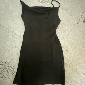 Never worn - tags removed. Above knee black spaghetti strap dress.